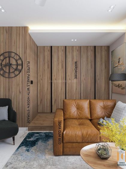 This annotated image shows the clever features of the TATA Promont room, including a concealed wardrobe and hidden storage within the fluted panels.