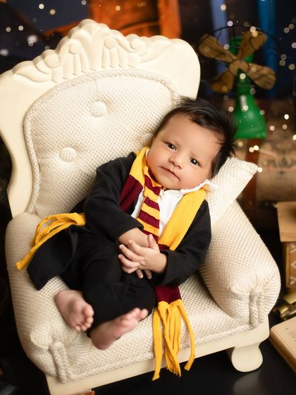 Awake and ready for a magical adventure. This alert moment during our Harry Potter session shows that we capture both sleepy and expressive portraits.