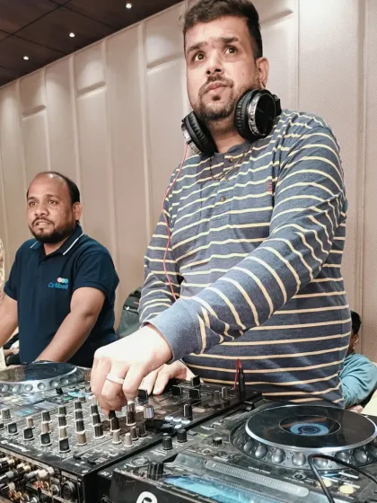 A candid shot while I'm focused on the music. It's all about delivering a great performance for the client.