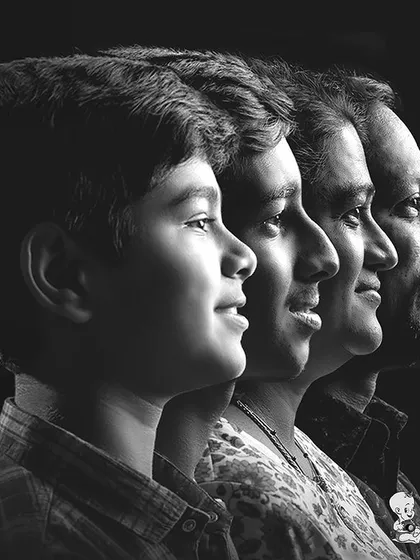 Beyond the colorful themes, I also offer classic family portraits. This black and white profile shot is a powerful way to create a timeless piece of art that focuses purely on the connection between family members.