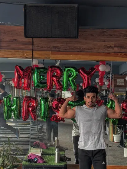 A member posing with our Christmas decorations. The gym is more than just a place to work out, it's a place to feel good and share positive energy.