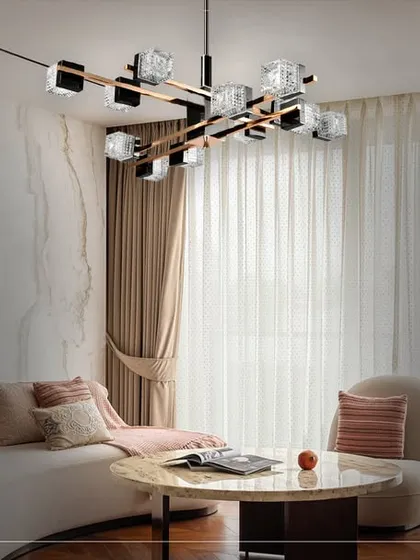 In this living room, a modern sculptural chandelier becomes the centerpiece. The design combines sharp angles with crystalline elements, providing brilliant, multi-directional light that is both functional and a work of art.