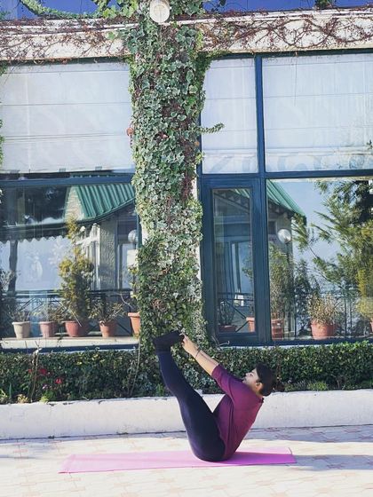 Holding the Boat Pose a little longer. The key is to keep your spine straight and engage your core to maintain balance and stability.