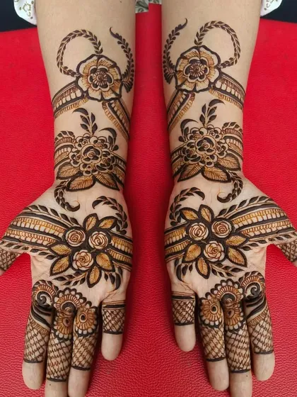 This design showcases a beautiful mix of floral and ribbon-like patterns flowing across both hands. The symmetry and shading give the flowers a very realistic and elegant look.