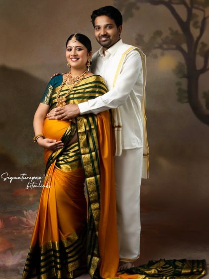 A classic couple portrait in traditional South Indian attire, radiating elegance and togetherness.