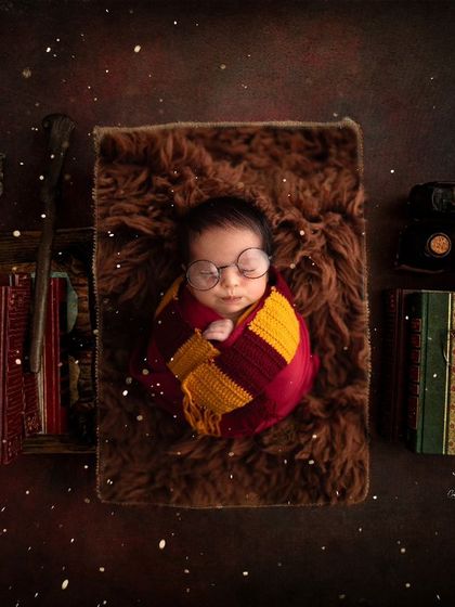 A more elaborate Harry Potter scene, complete with spellbooks and magical lighting. I love building these detailed worlds for your baby's portraits.