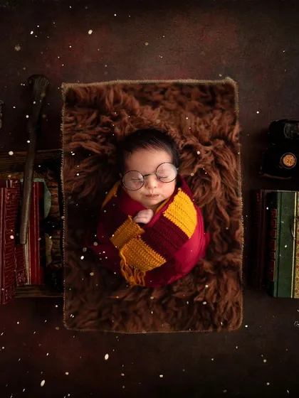 A more elaborate Harry Potter scene, complete with spellbooks and magical lighting. I love building these detailed worlds for your baby's portraits.