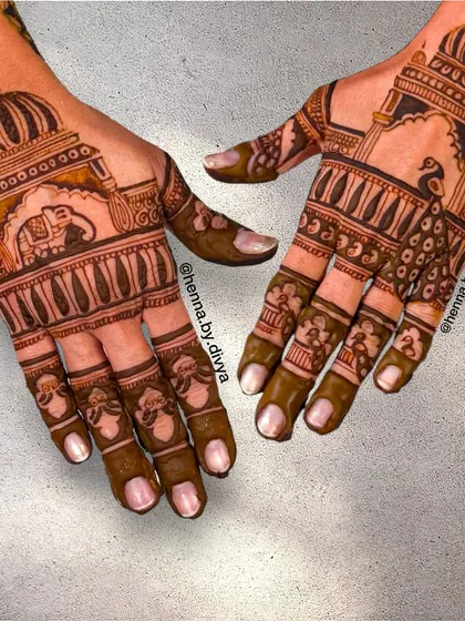 This design features grand palace domes on the back of the hands, with one hand showcasing a royal elephant and the other a graceful peacock.