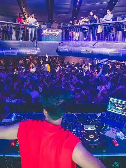 My view from the DJ booth at a packed club. I thrive on the energy of the crowd, mixing tracks that keep the dance floor full and the vibe electric all night long.