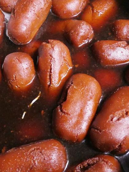 Freshly made Gulab Jamuns soaking in sugar syrup. This classic Indian sweet is a must-have at any celebration and is a specialty of mine.