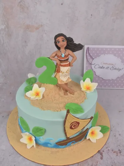A Moana-themed cake for a 2nd birthday. I love integrating the age into the design, and having the character lean against the number is a great way to make it look cohesive.