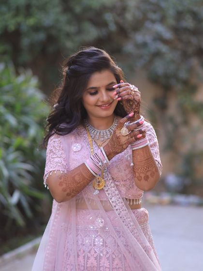 A close-up of this gorgeous pink engagement lehenga. The intricate embroidery and delicate details are perfect for a bride-to-be who loves a soft, romantic look.