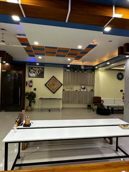 Another perspective of our spacious new office, showing the recreation area with a carrom board and ample open space.