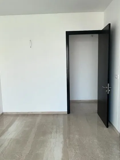 The 'before' shot of the guest bedroom. A simple, empty room waiting for a story.