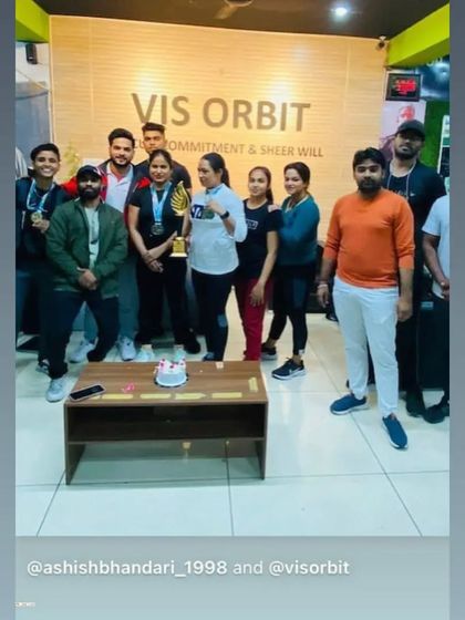 Celebrating our championship win with a cake at Vis Orbit gym.