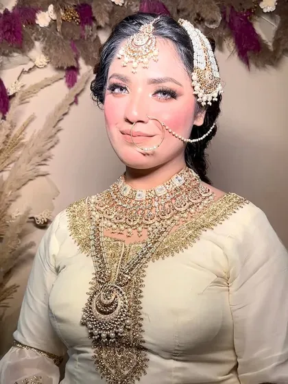 Another beautiful shot of the Nikkah bride, highlighting the flawless base and soft pink blush.