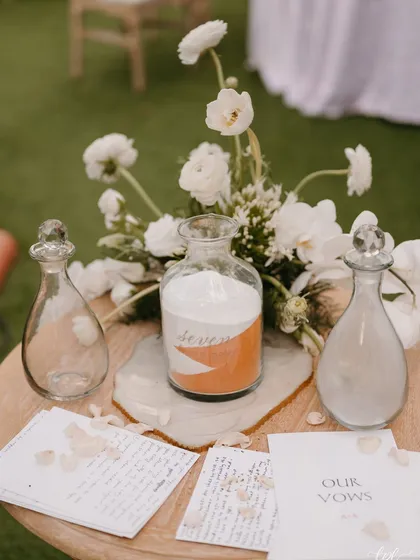 The sand ceremony setup, where the couple poured two different colors of sand into a single jar to symbolize their union.