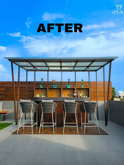 A straight-on "after" view of the custom rooftop bar. The clean lines, wood paneling, and stylish bar stools create a modern and sophisticated look, perfect for entertaining.