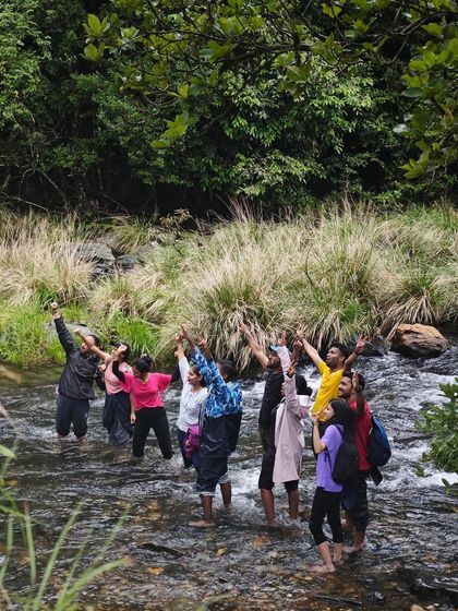 Our group enjoying a refreshing dip in a stream during the Kurinjal trek.