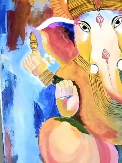 A close-up on the expressive eyes and trunk of the Ganesha painting. I use fine brushwork to add details that bring the deity's compassionate character to life.