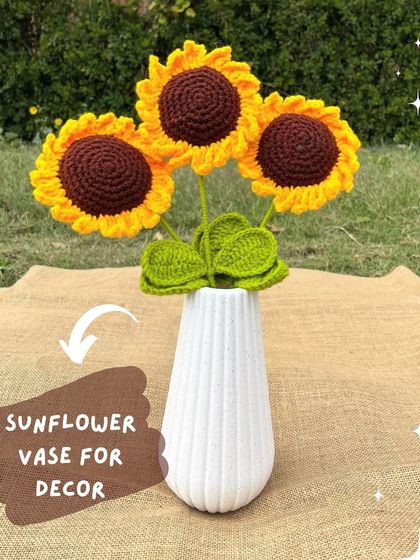 A beautiful way to decorate your home. Three of our crochet sunflowers look stunning in this simple white vase, adding a permanent touch of sunshine.