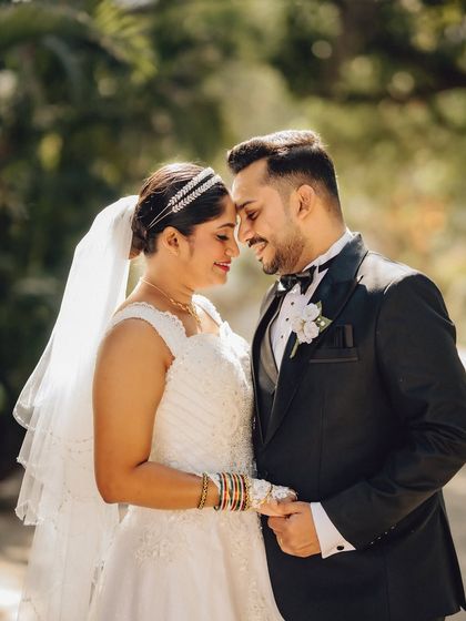 An intimate forehead-to-forehead pose, capturing a quiet moment of connection. These are the timeless, romantic portraits I love to create.