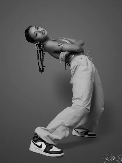 A black and white shot of the bent-back pose, emphasizing the form and shadow.