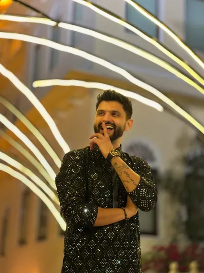 A more traditional, shimmery black kurta for a Sangeet night. This look is all about desi glam.