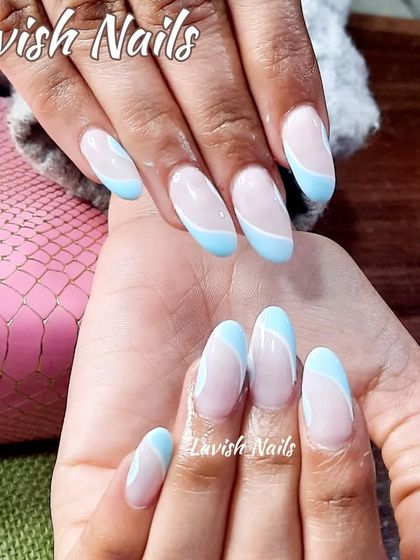 A soft and pretty abstract design with light blue and white swirls on a sheer pink base.