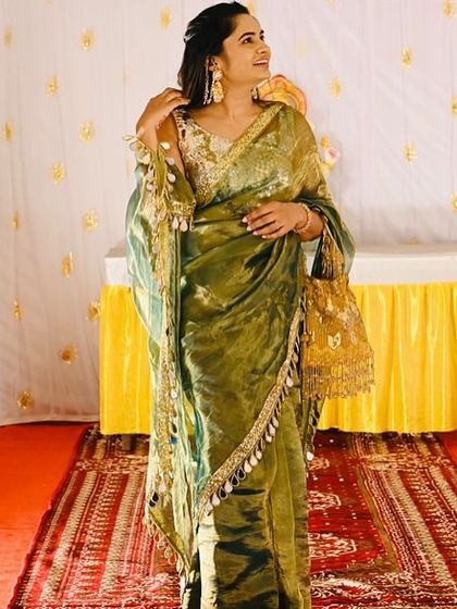 It brings me so much joy to see my clients styling my pieces. Here, a beautiful client pairs a shimmering olive green saree with one of my golden potli bags, creating a stunning look for a wedding function.