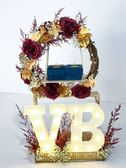 This personalized engagement ring platter combines a romantic floral wreath with custom light-up initials, making it a truly unique centerpiece for your celebration.