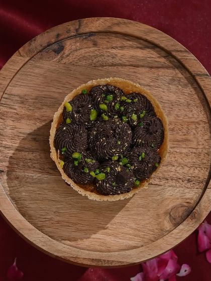 A close-up of my decadent chocolate ghewar, a perfect fusion dessert for modern festive celebrations like Teej.