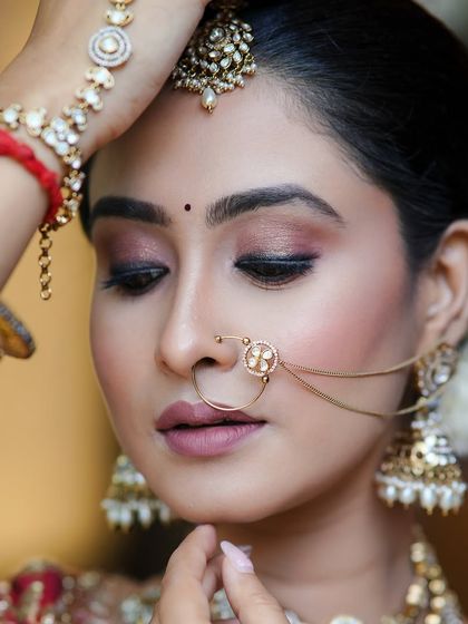 Another beautiful shot from the photoshoot, highlighting the intricate details of the jewellery and the soft, romantic makeup.