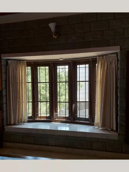 A duplicate of the bay window, emphasizing its role in connecting the interior to the outside.