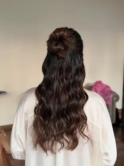 A classic and chic look for influencer Urmi Daga. I styled her hair in a modern half-up top knot with waves and gave her a timeless makeup look with winged liner and red lips.