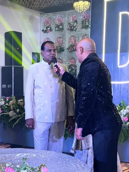 An anchor from my team interacting with a guest on stage. We provide professional anchors who can engage the audience and keep the energy high throughout the event.