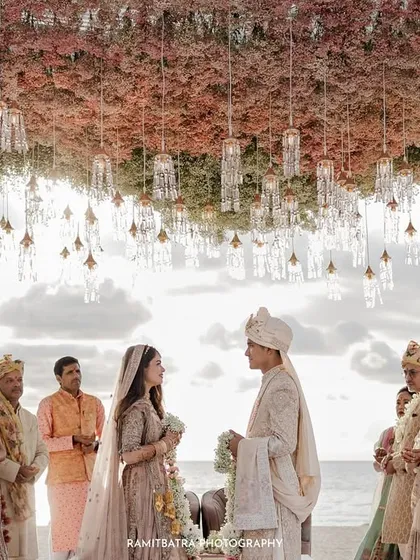 The serenity of sunset pheras on a beach in Thailand. I focus on capturing the quiet beauty and profound emotion of the ceremony, with the setting sun and the sea providing a perfect, natural canvas for the couple's vows.