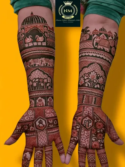 This design uses a rich red henna stain to showcase swans, elephants, and palace architecture, with the couple's initials hidden in the palms.