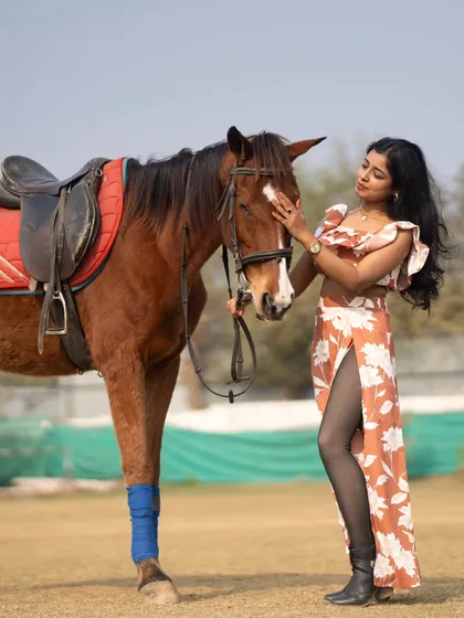 A classic pose for an equestrian photoshoot, highlighting the bond and mutual respect.