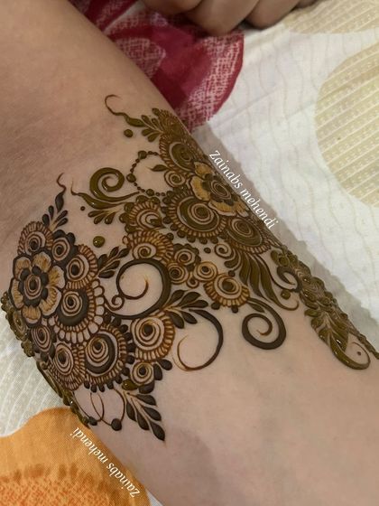 A close-up of the armband portion of this flowing design, showing the beautiful start to the full piece.