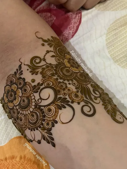 A close-up of the armband portion of this flowing design, showing the beautiful start to the full piece.