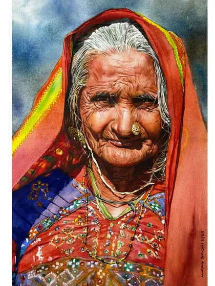 A study in color and character. This portrait of a woman in a vibrant red headscarf demonstrates how to balance bold colors with the delicate, weathered textures of the skin.