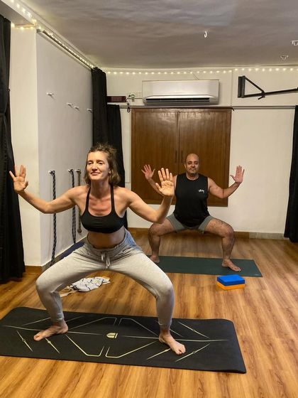 Goddess pose in our evening class. This posture is fantastic for strengthening the quads, glutes, and inner thighs while opening the hips.