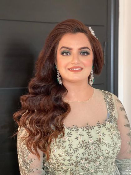 The look of the day. These side-swept Hollywood waves are perfect for a glamorous evening event.