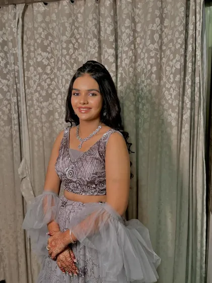 A full view of her grey lehenga look, perfect for a reception or sangeet night.
