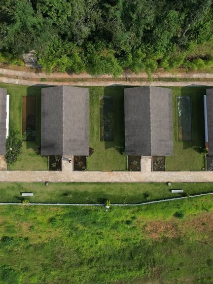 An aerial view of a modern cottage stay in Shivamogga, offering comfort while still being close to nature.