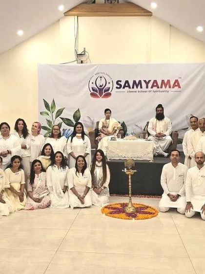 A group photo from our Himachal retreat, with everyone dressed in white, signifying peace and purity.