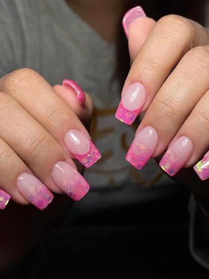 A full view of the stunning pink ombre and glitter acrylic extensions.