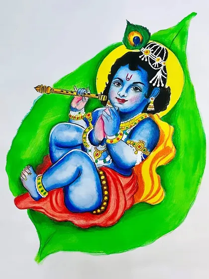 A colorful painting of Bal Krishna (baby Krishna) on a leaf. This Janmashtami special piece is full of vibrant colors and divine innocence.