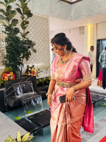 A candid shot of Dr. Niharika, the soft silk drape of her saree looking elegant and timeless.